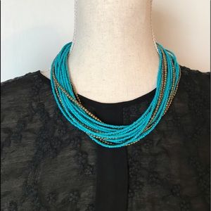 Turquoise bead necklace.